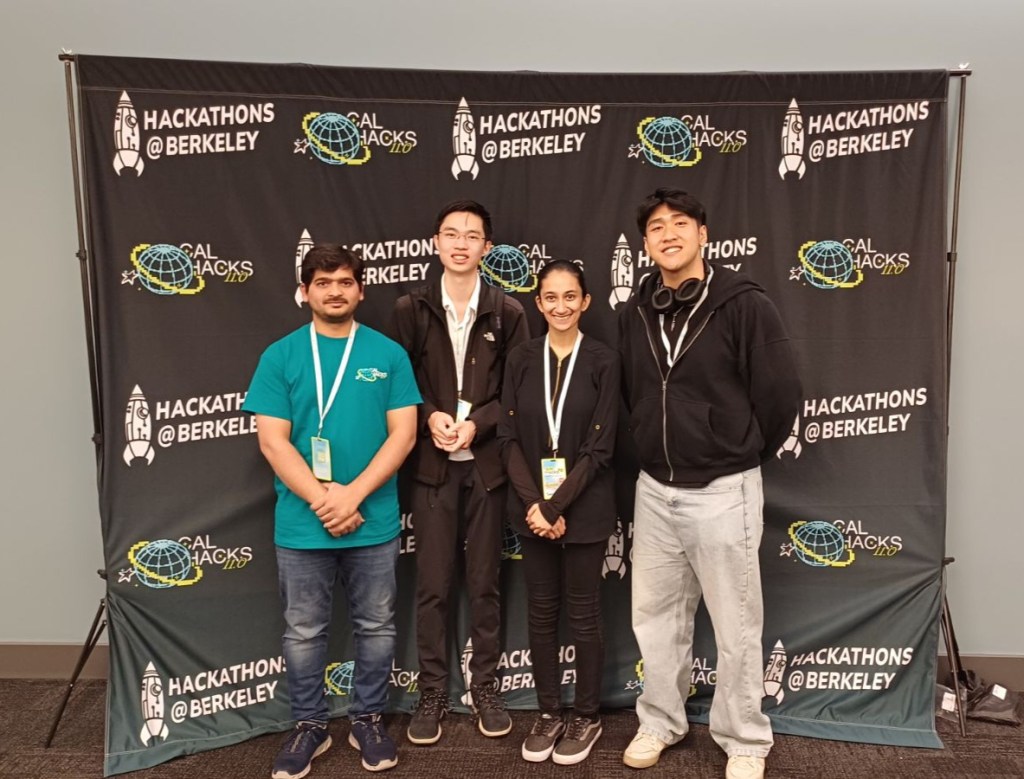 Pacific students stand in front of a Cal Hacks-branded background after winning first place in the web app category.